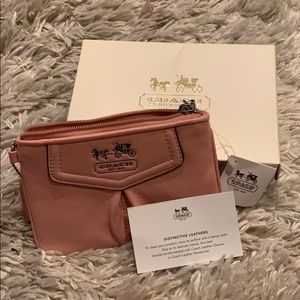 Baby pink Coach wristlet